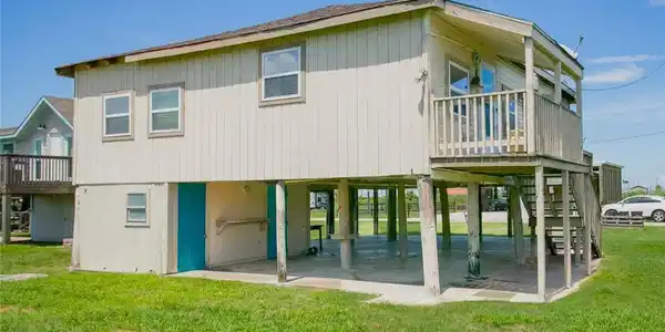 Image 3: View from the back of the home. The first turquois