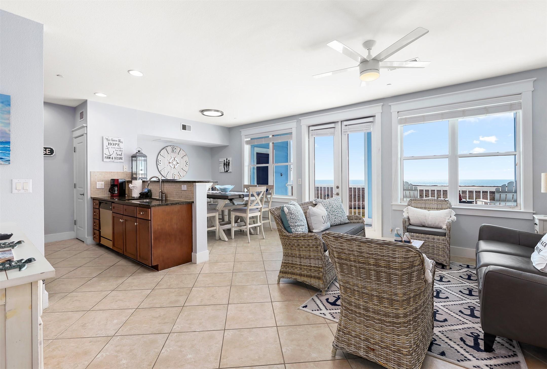 Image 4: Open-concept living spaces capture Gulf views from