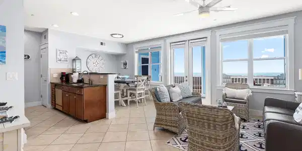 Image 4: Open-concept living spaces capture Gulf views from