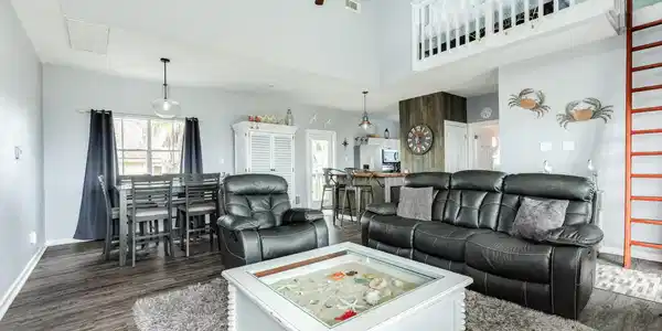 Image 2: Seamless flow between the living room and dining s