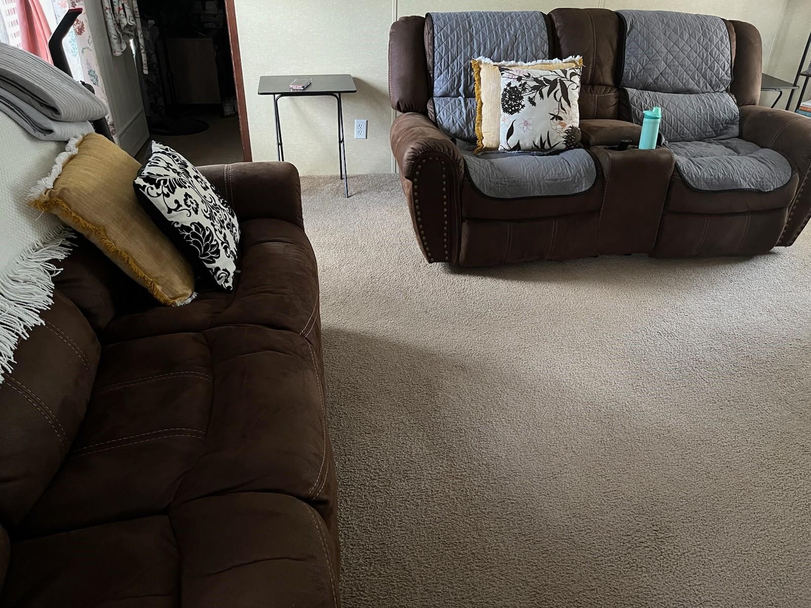 Image 4: The living room has plenty of space for comfortabl