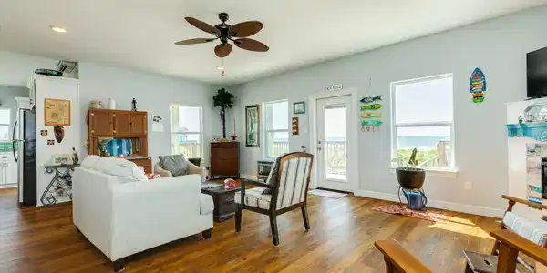 Image 4: Bright, open-concept living space with large windo