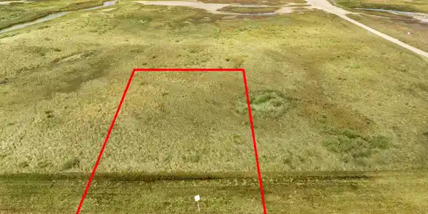 Image 2: Cleared beachfront lot with direct road frontage a