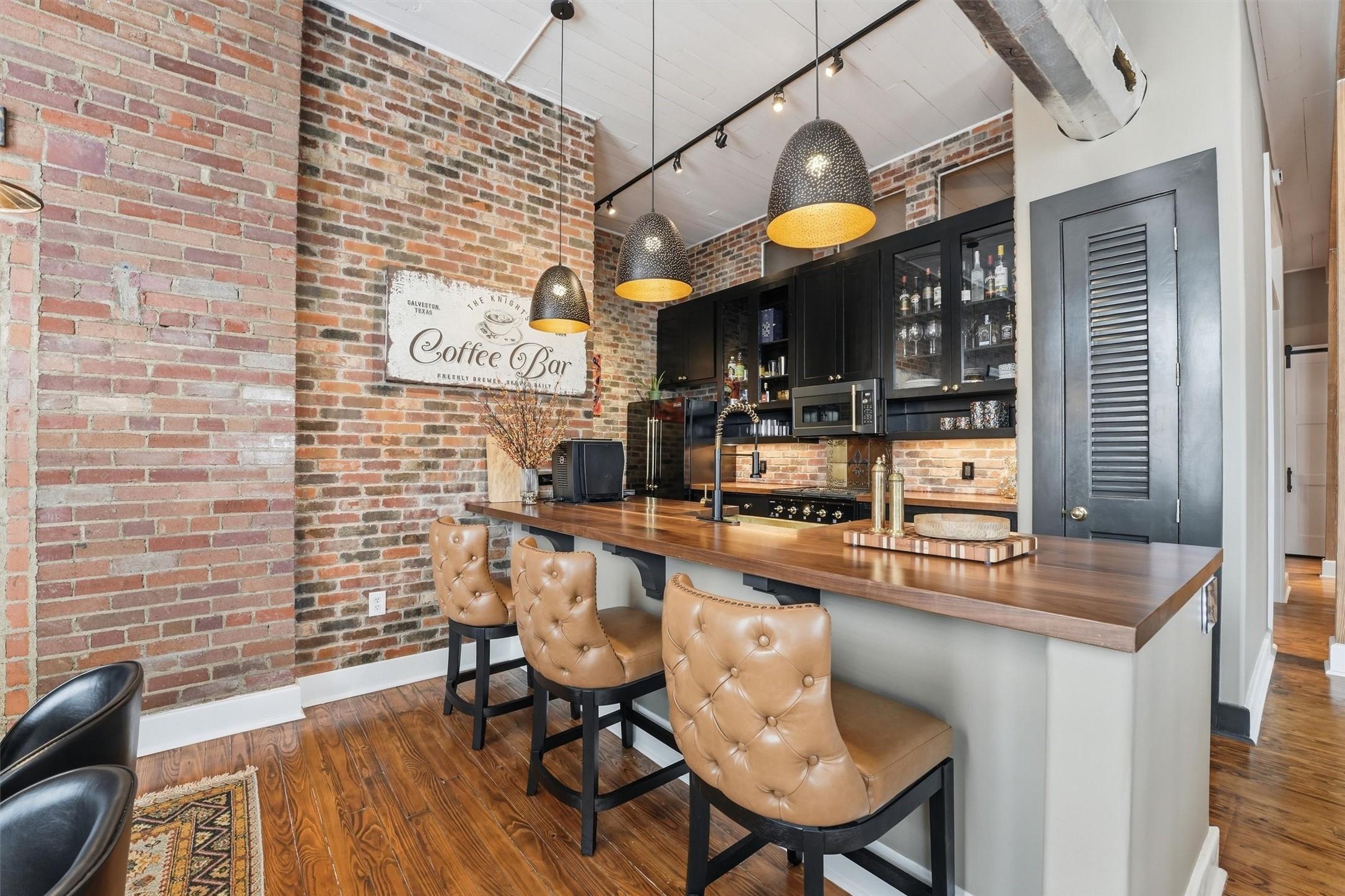 Image 2: Updated kitchen showcasing butcher block counterto