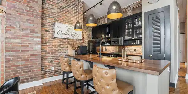Image 2: Updated kitchen showcasing butcher block counterto