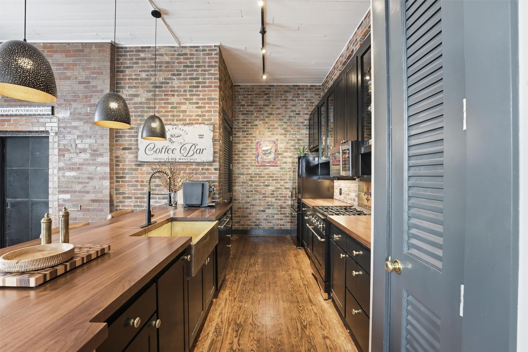 Image 3: Updated kitchen showcasing butcher block counterto