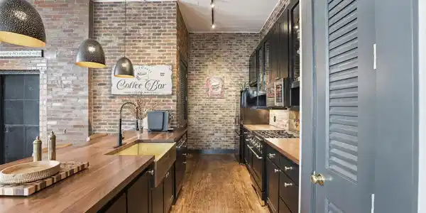 Image 3: Updated kitchen showcasing butcher block counterto