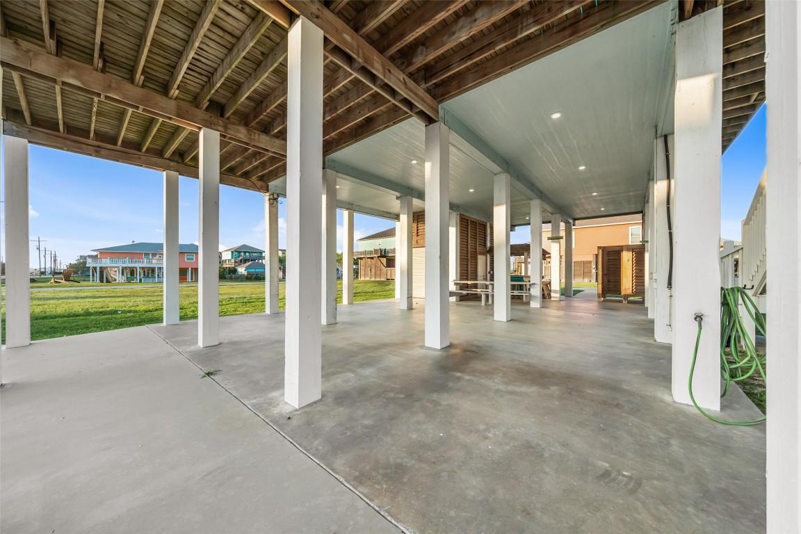 Image 4: Open ground-level area features plenty of room for