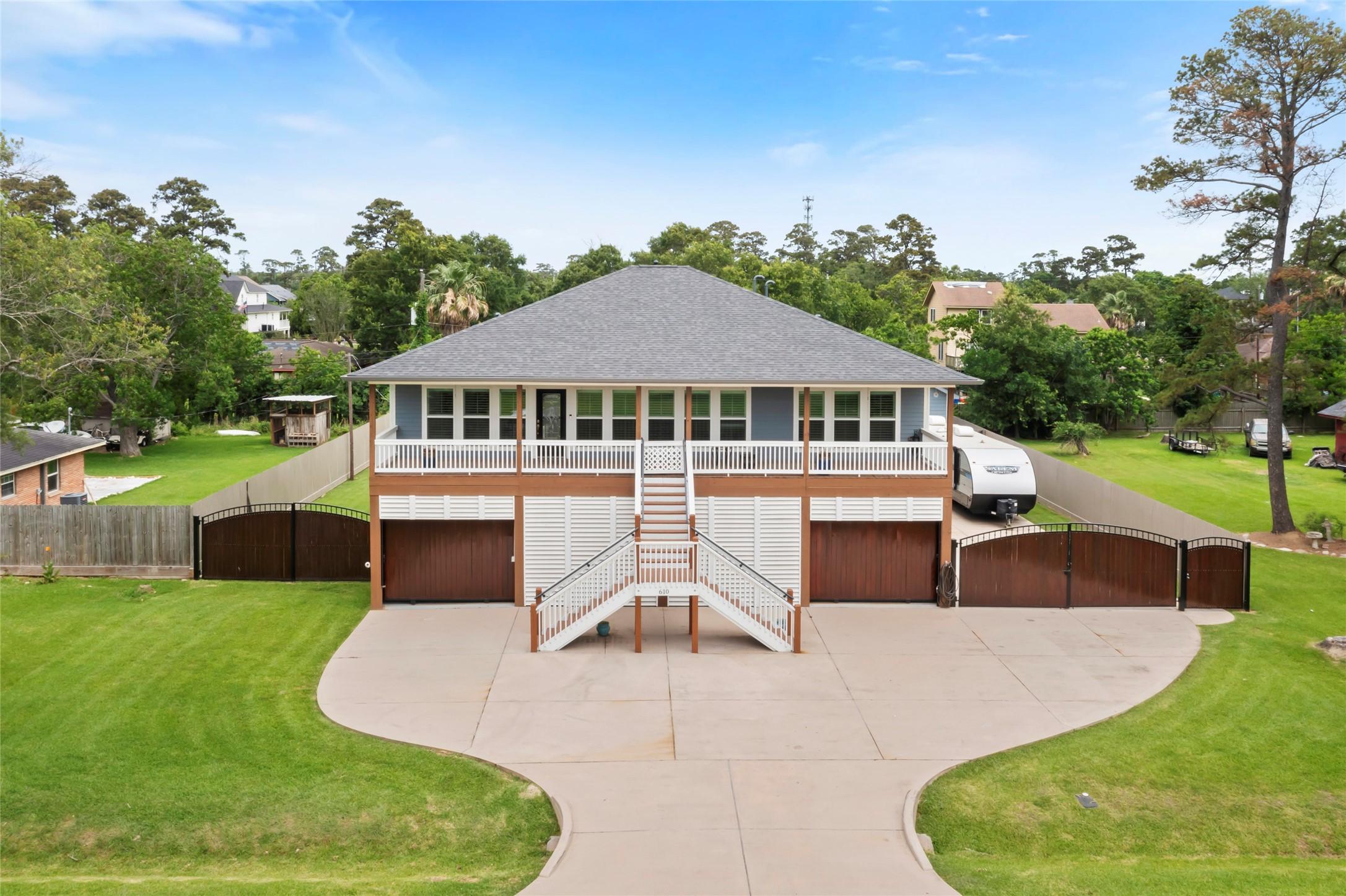 Image 2: This home features a spacious elevated design with