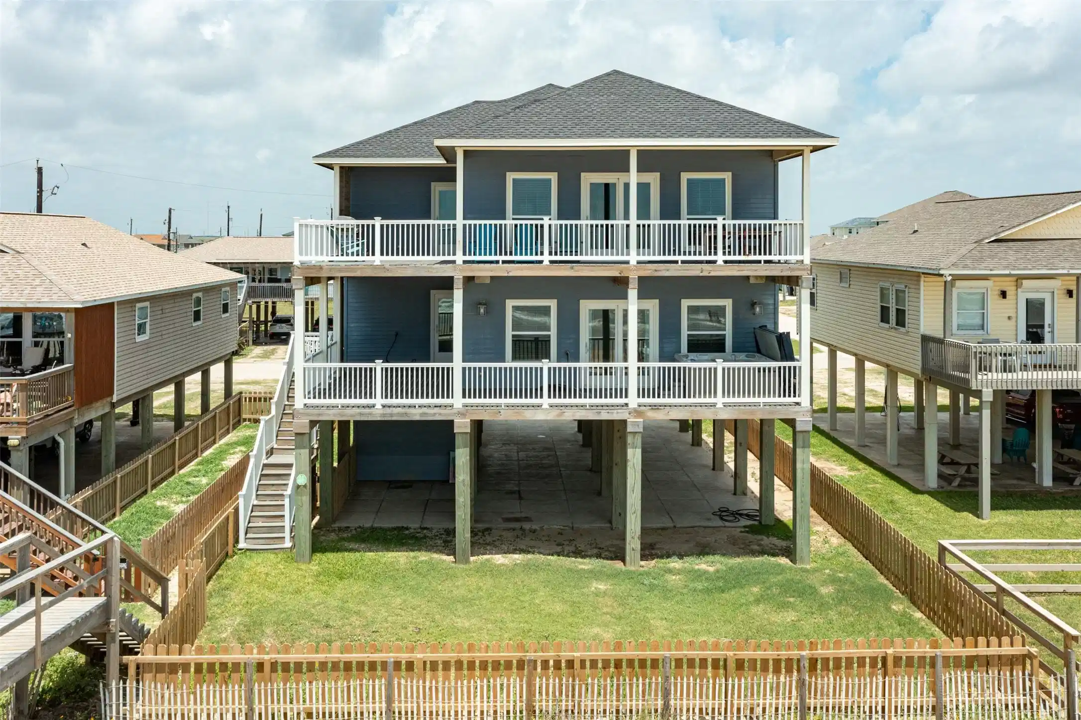 Image 1: Elevated two-story home with a modern design, feat