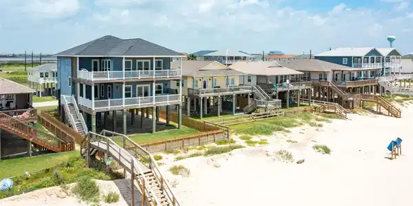Image 4: This photo showcases a row of elevated beachfront