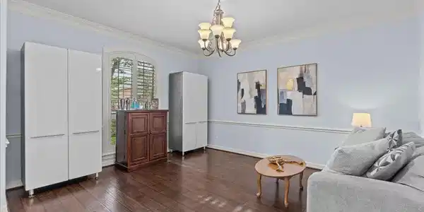 Image 4: Just inside the front door is a living room or din