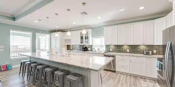 Image 4: Main kitchen has huge island for hosting.