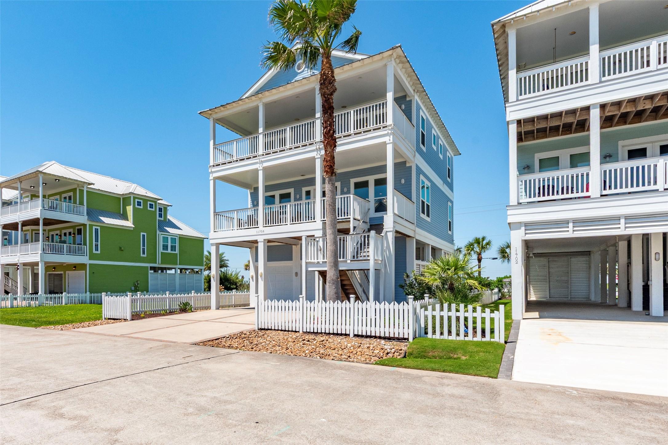 Image 1: This image features a modern, three-story coastal