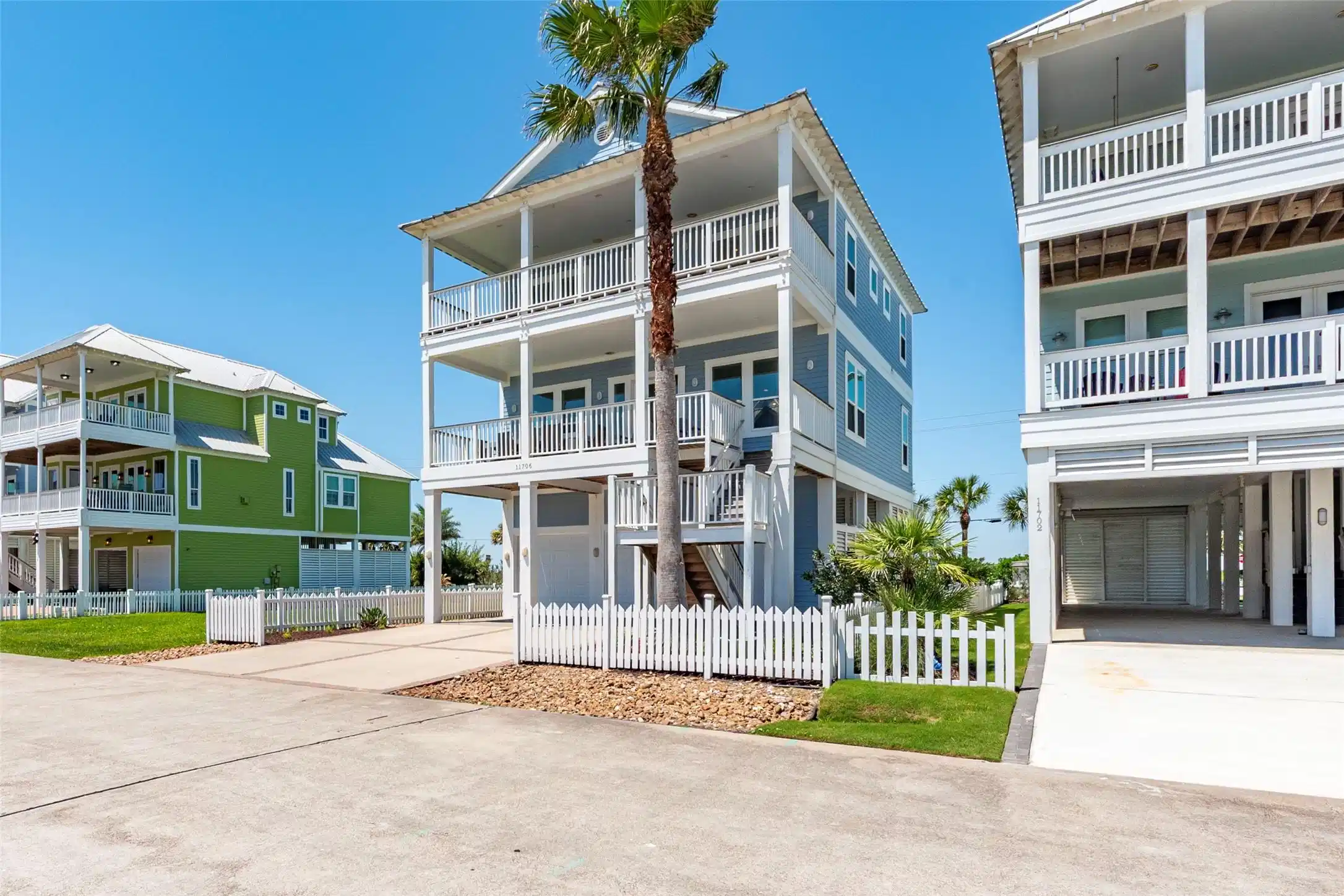 Image 1: This image features a modern, three-story coastal