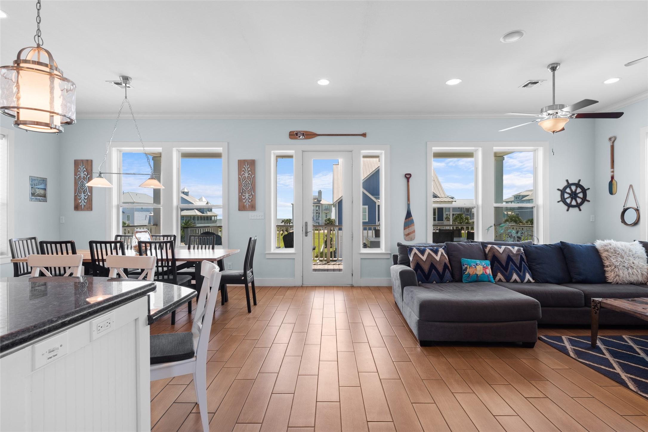 Image 2: This photo showcases a bright, open-concept living