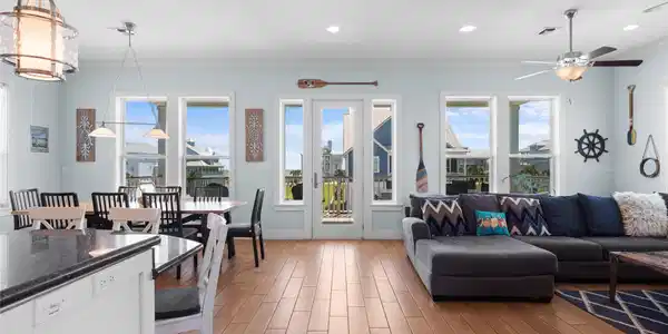 Image 2: This photo showcases a bright, open-concept living