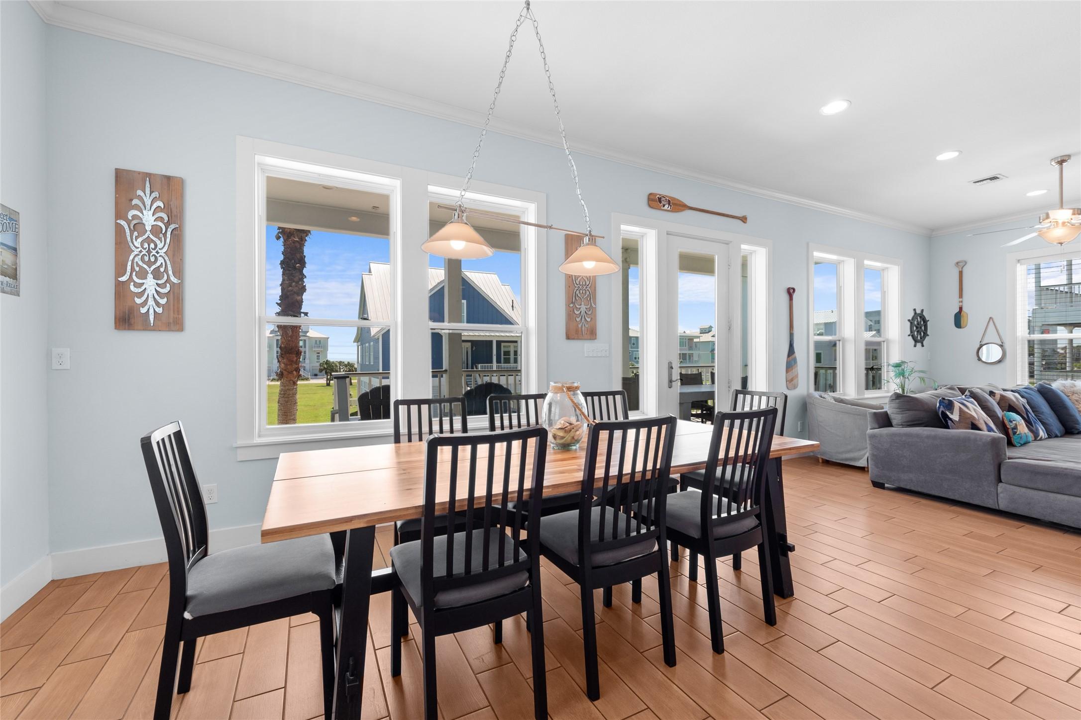 Image 4: This bright, open-concept living and dining area f