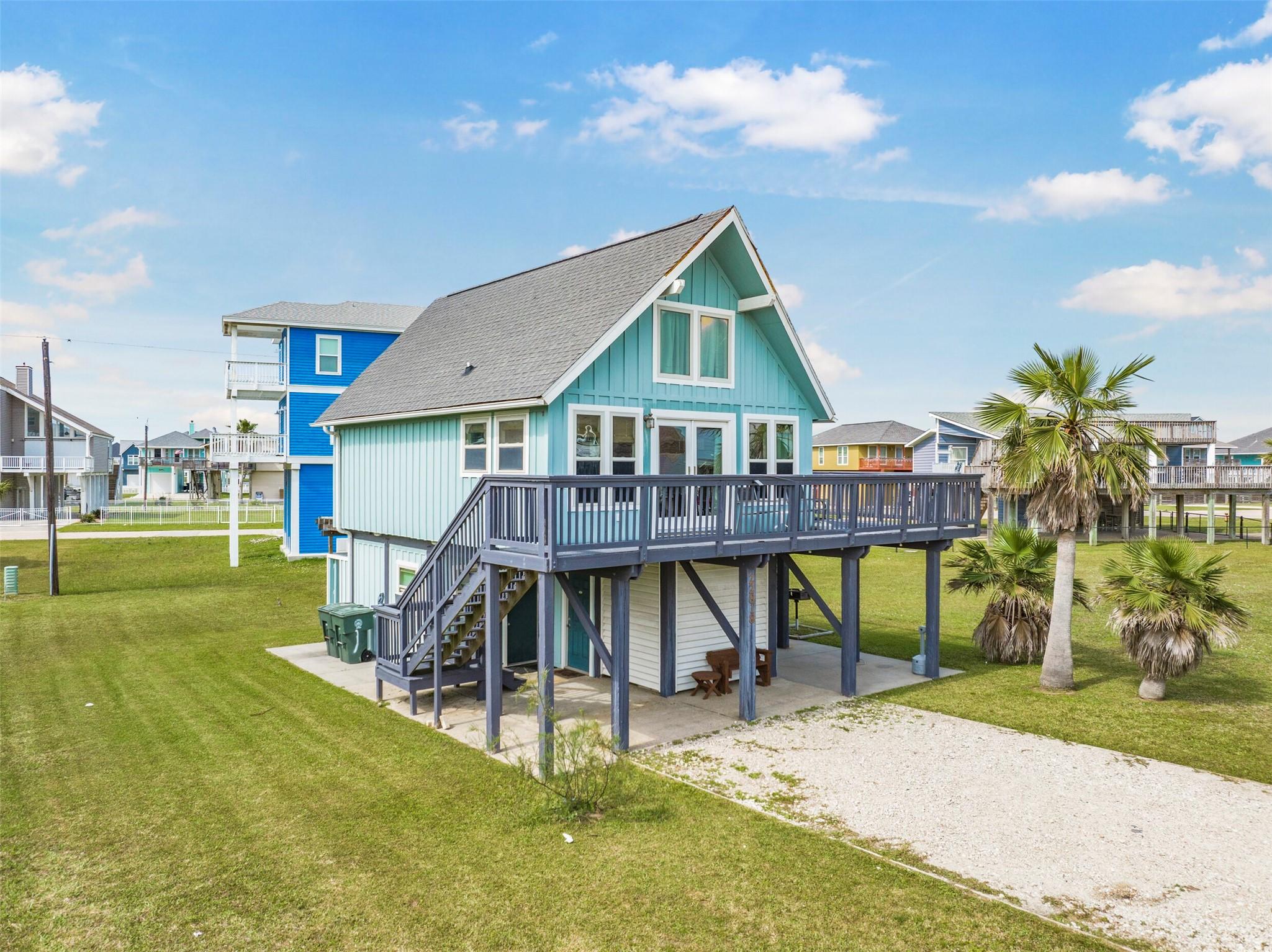 Image 3: This charming coastal home features elevated desig