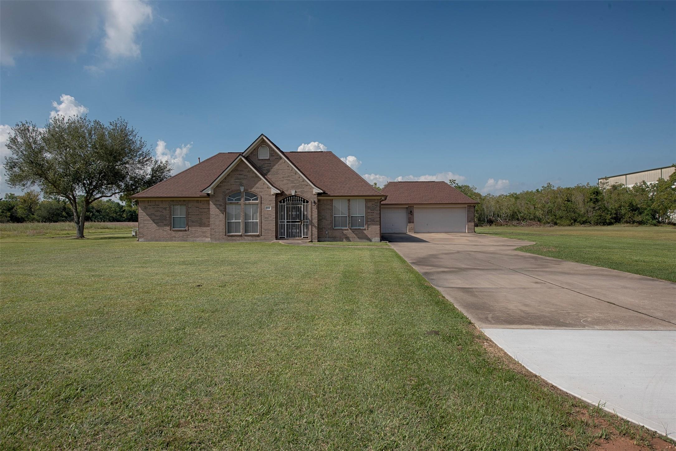 Image 2: Home has beautiful curb appeal on a huge lot.