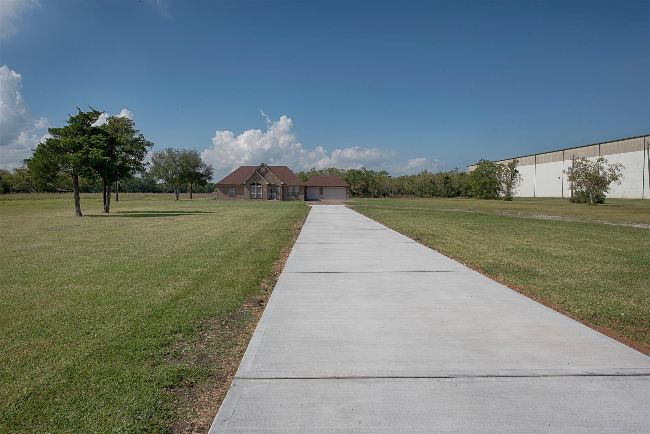 Image 4: A new long concrete driveway has been added to the