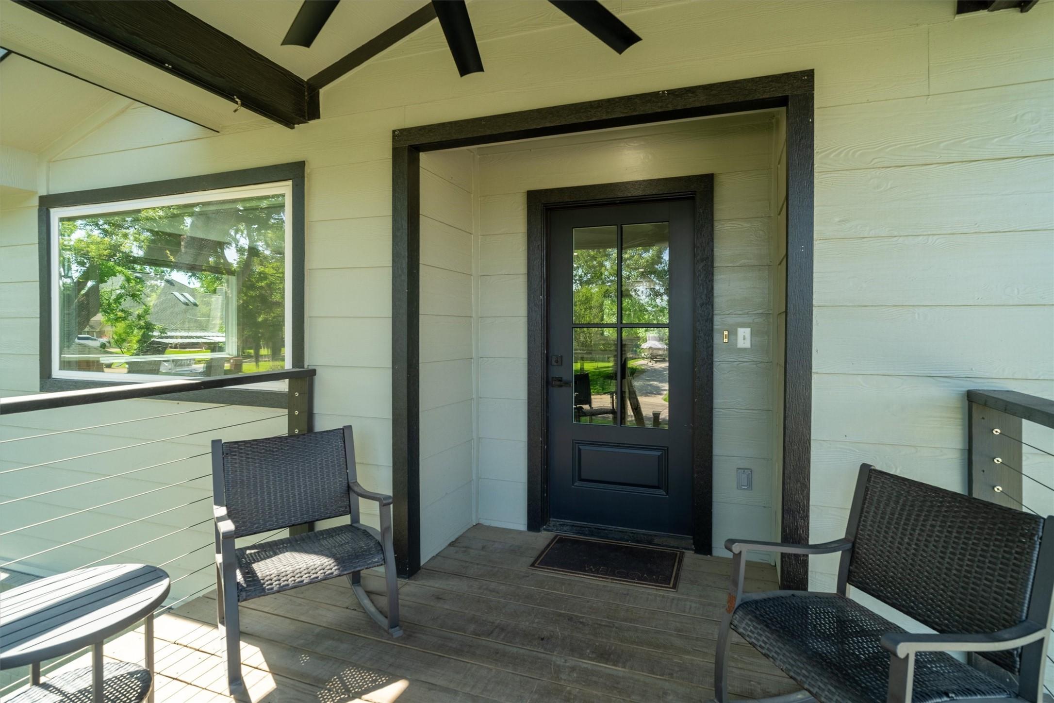 Image 4: Covered front patio with room for seating