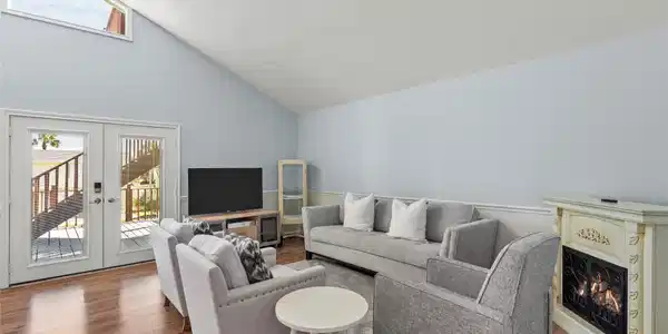 Image 4: Sunlight fills this airy living room through Frenc