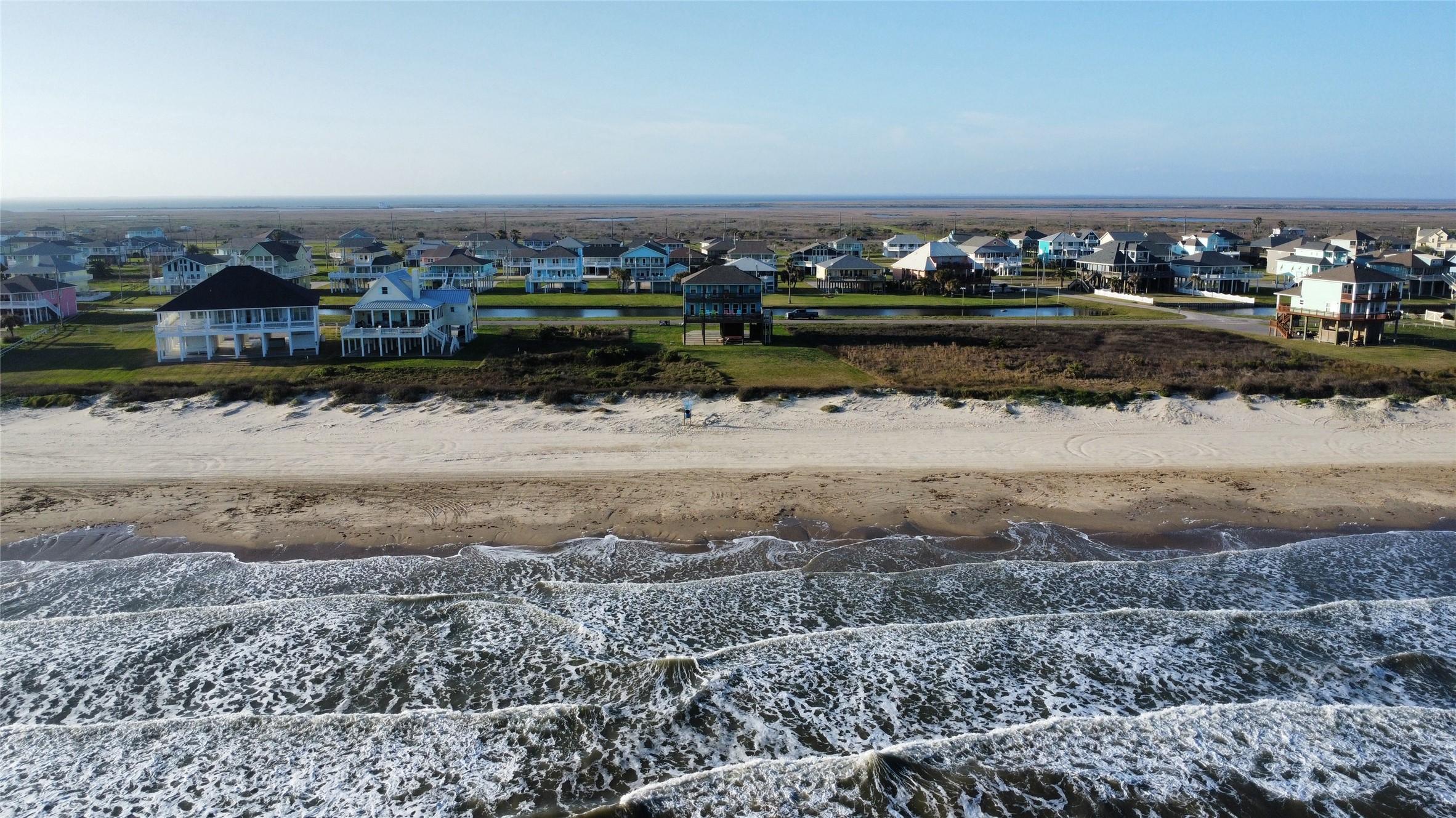 Image 3: Aerial view from over the Gulf back to the house