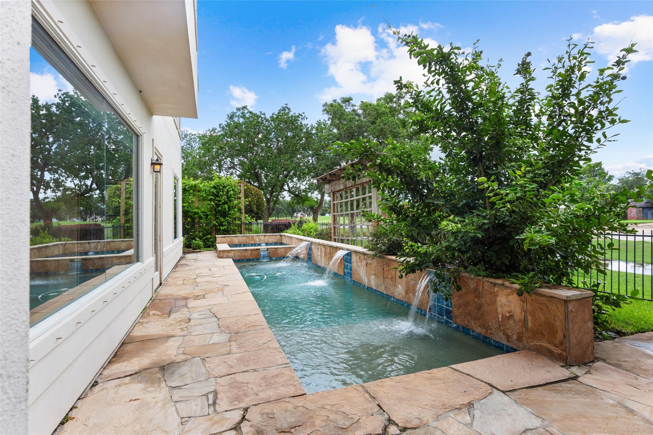 Image 3: Beautiful lap pool is perfect for those hot summer
