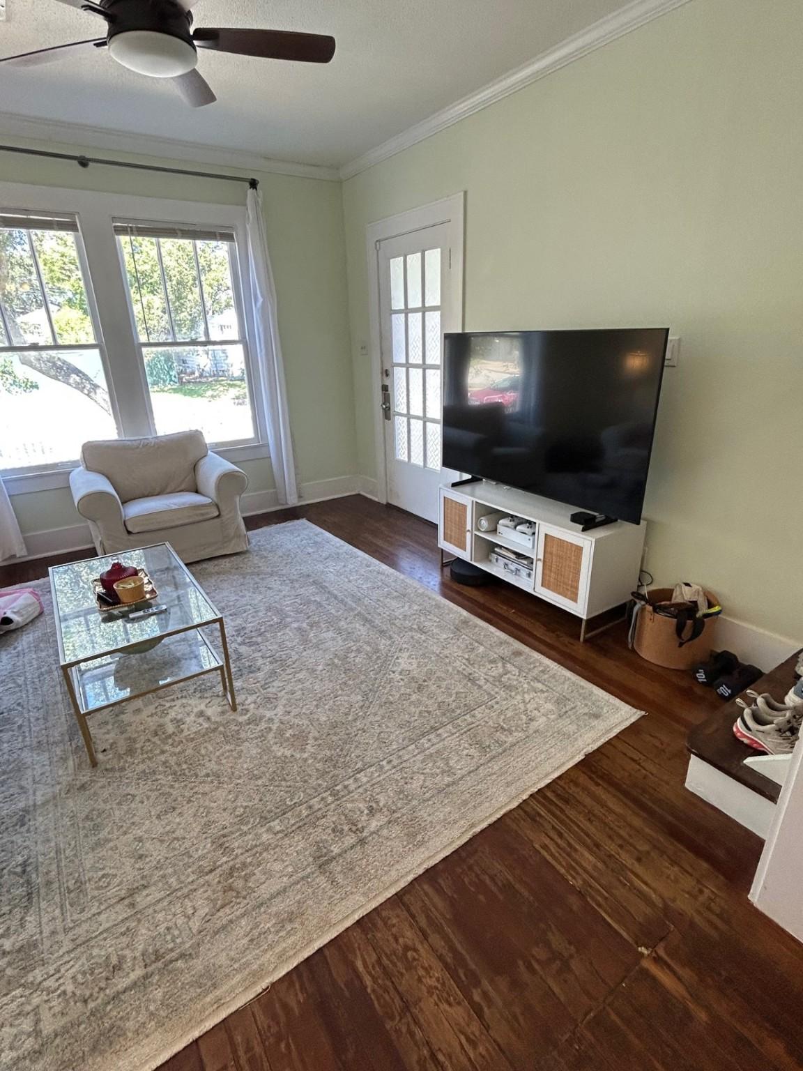 Image 4: Front living room with front door in the backgroun
