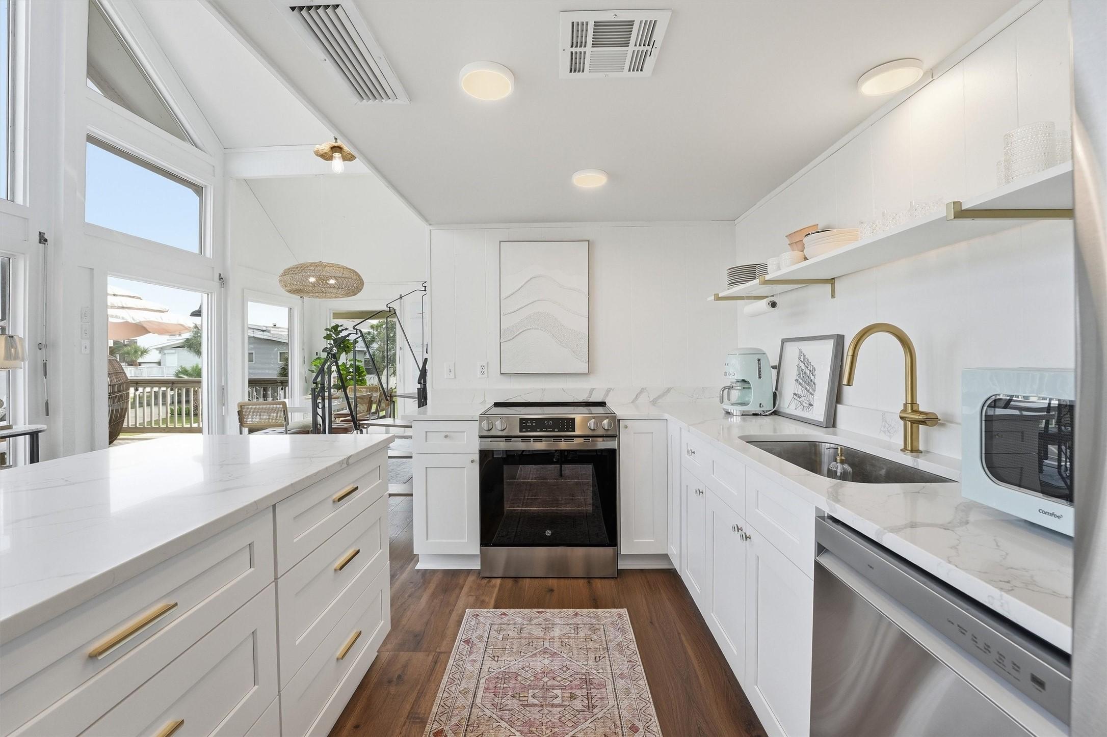 Image 4: quartz countertops, white shaker cabinets with add
