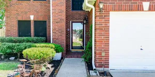 Image 4: A closer look at the brick exterior and welcoming