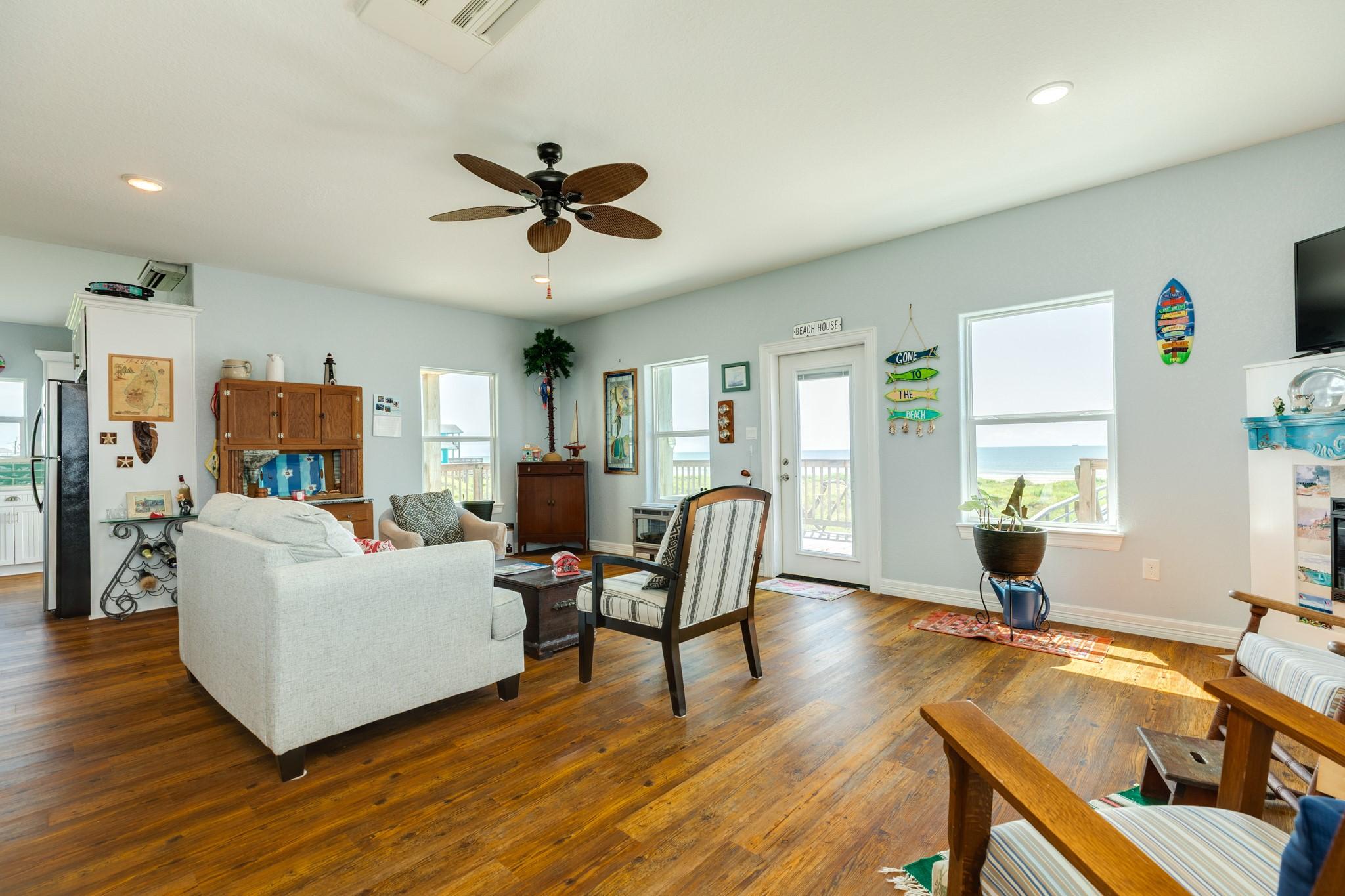 Image 4: Bright, open-concept living space with large windo