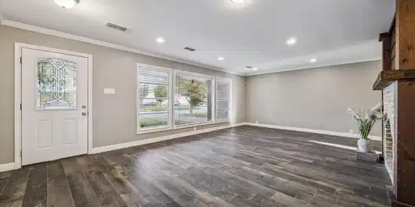 Image 3: Elegant living area with wood-look flooring, abund