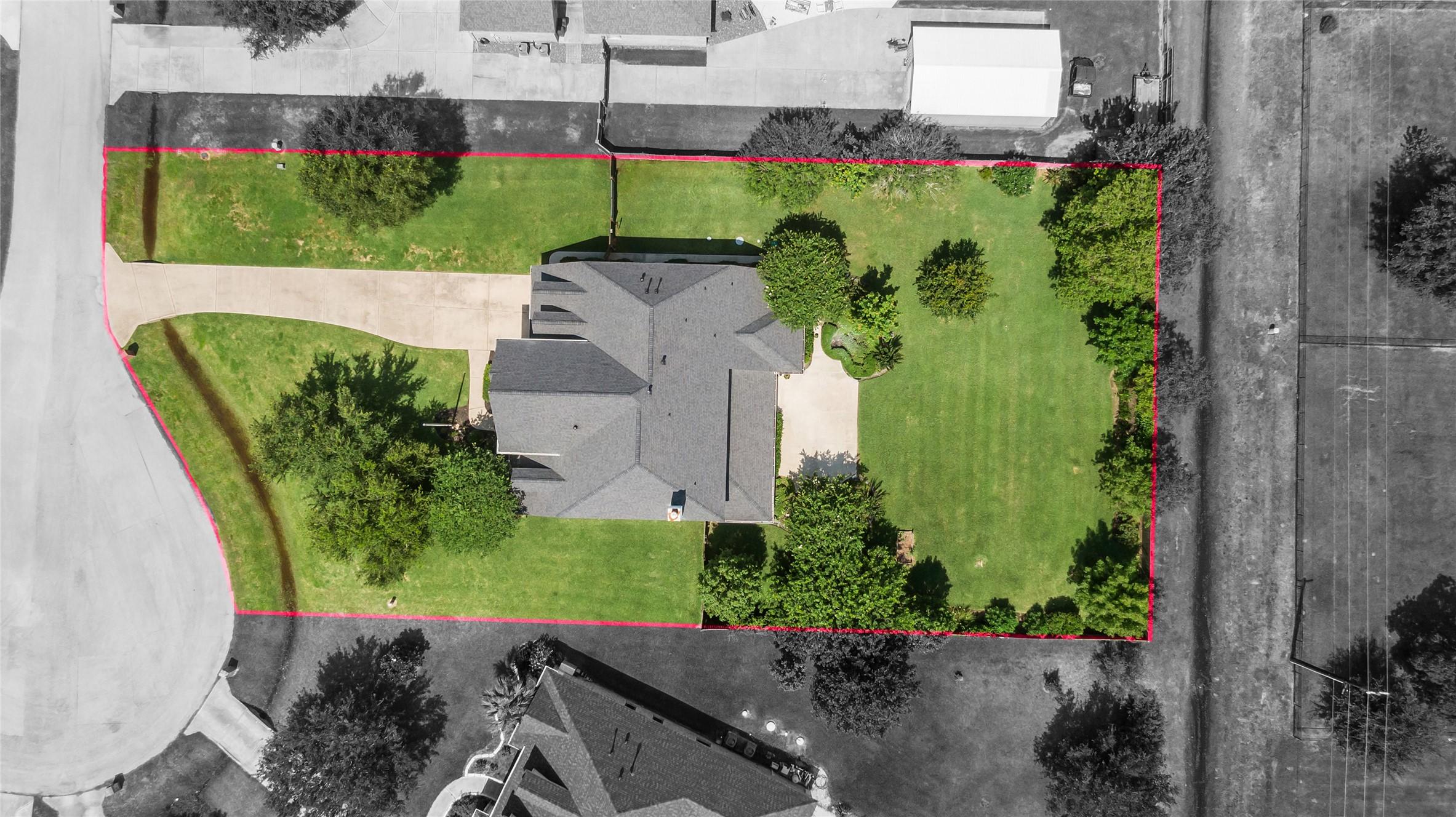 Image 2: Aerial of home on 3/4 acre lot