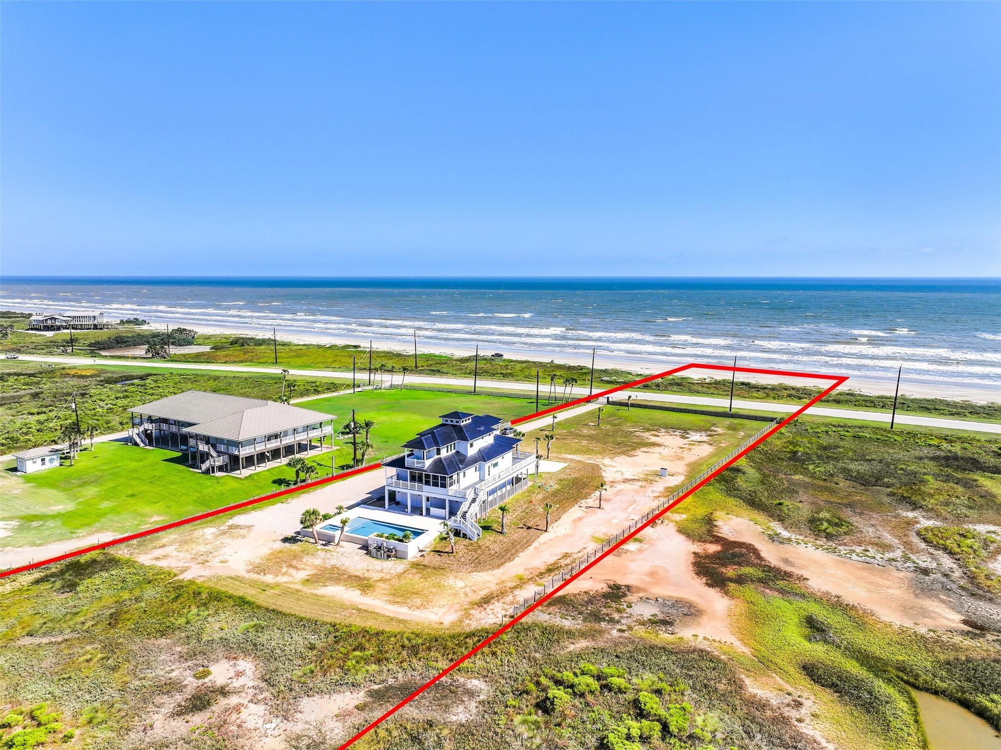 Image 2: A bird's eye view of the expansive BEACHFRONT prop