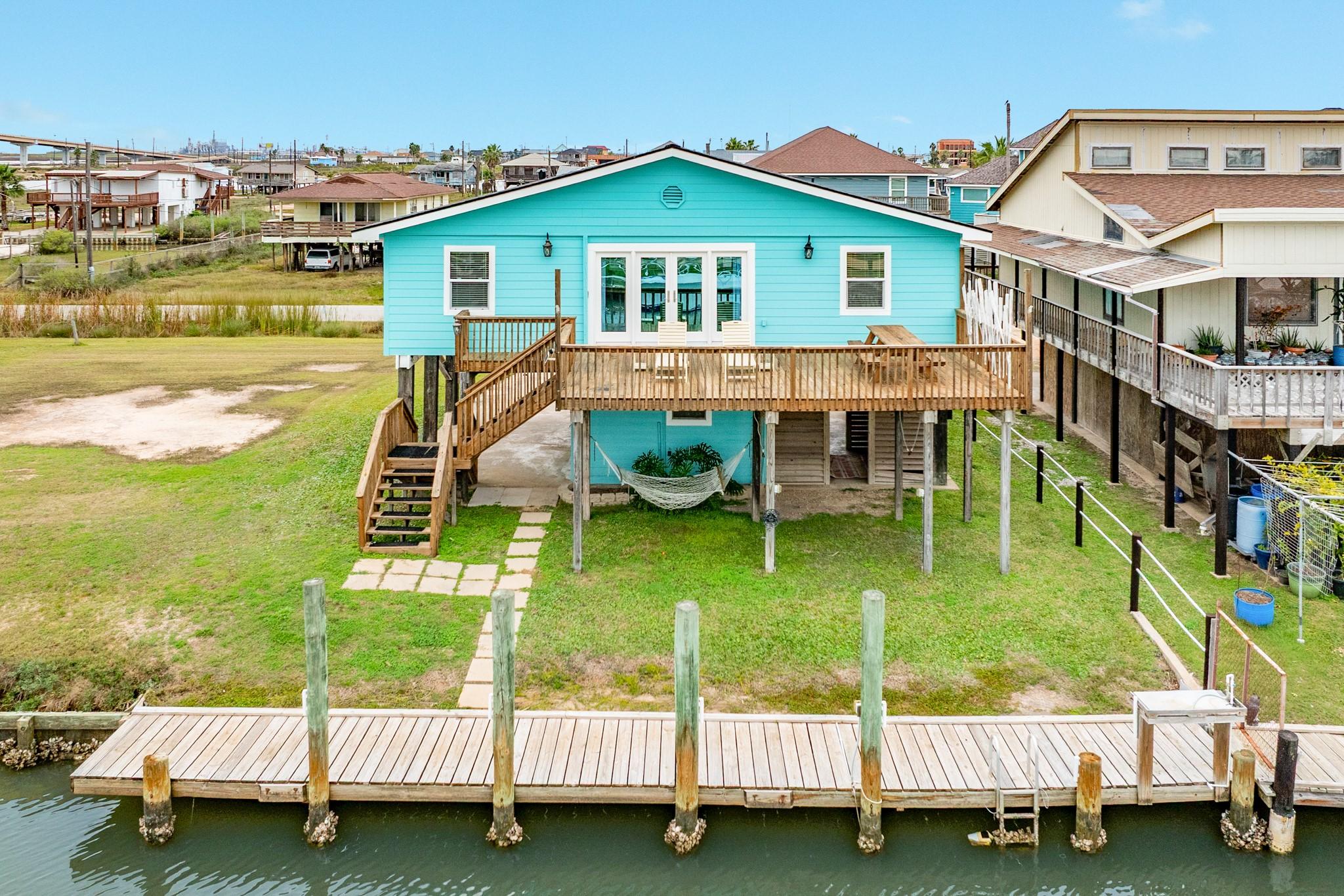 Image 3: This rear view highlights the home&rsquo;s elevated cons