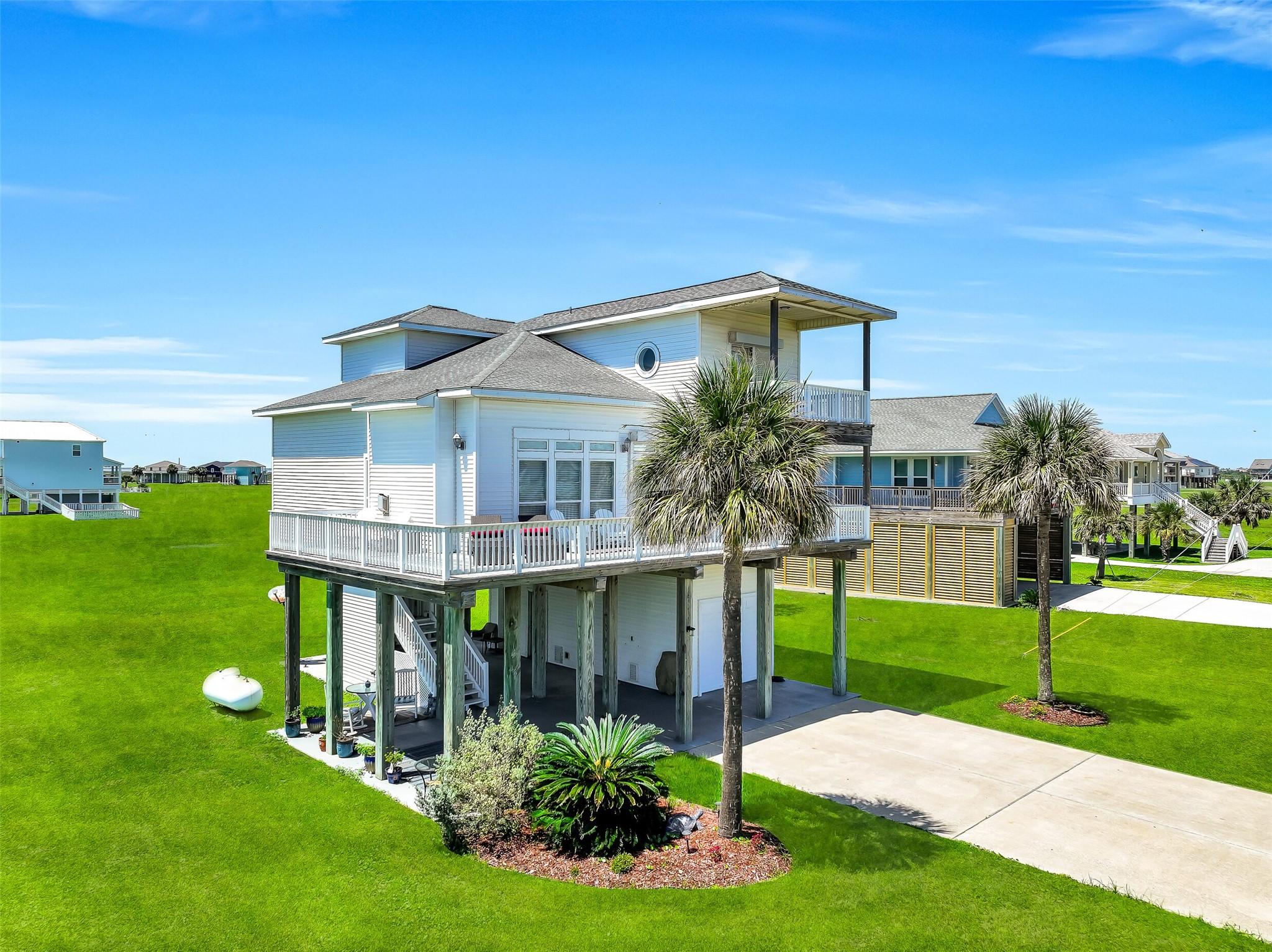 Image 2: This home is situated on an expansive corner lot j