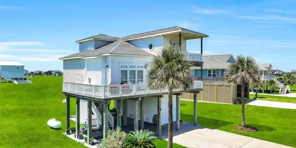 Image 2: This home is situated on an expansive corner lot j