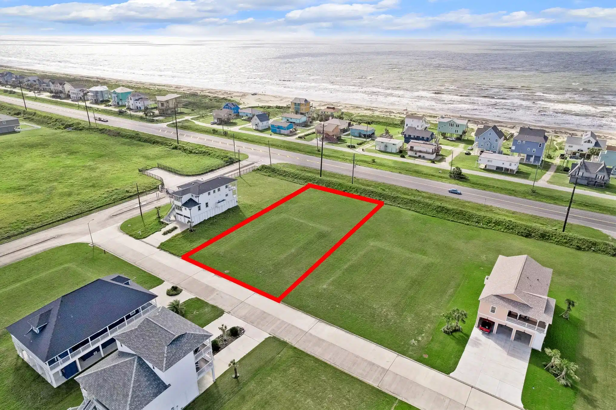 Image 1: Framed by finished coastal homes, this lot enjoys