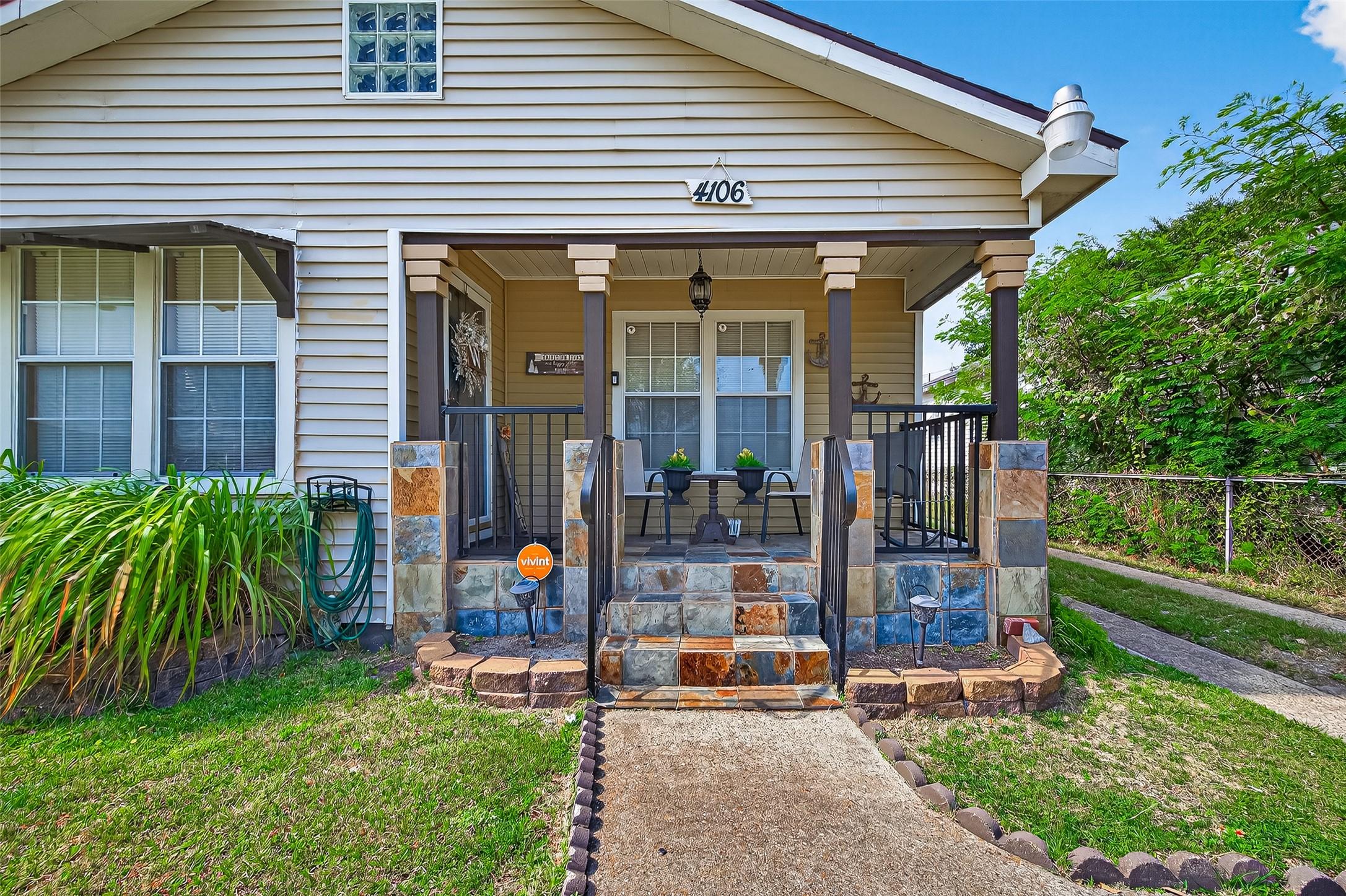 Image 3: Charming curb appeal with a serene front porch.
