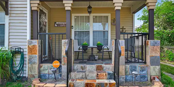 Image 4: Charming front porch featuring elegant slate tiles