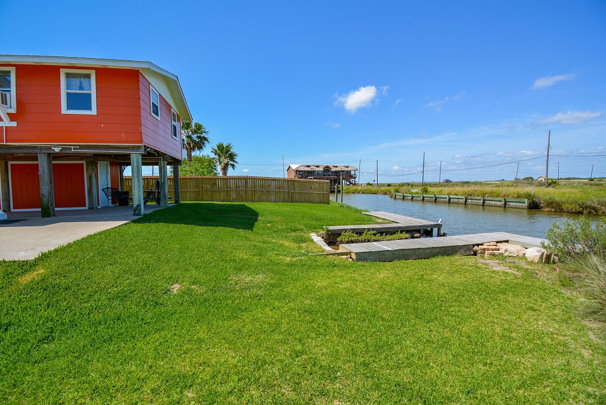Image 2: Your own waterfront escape! Enjoy a spacious backy