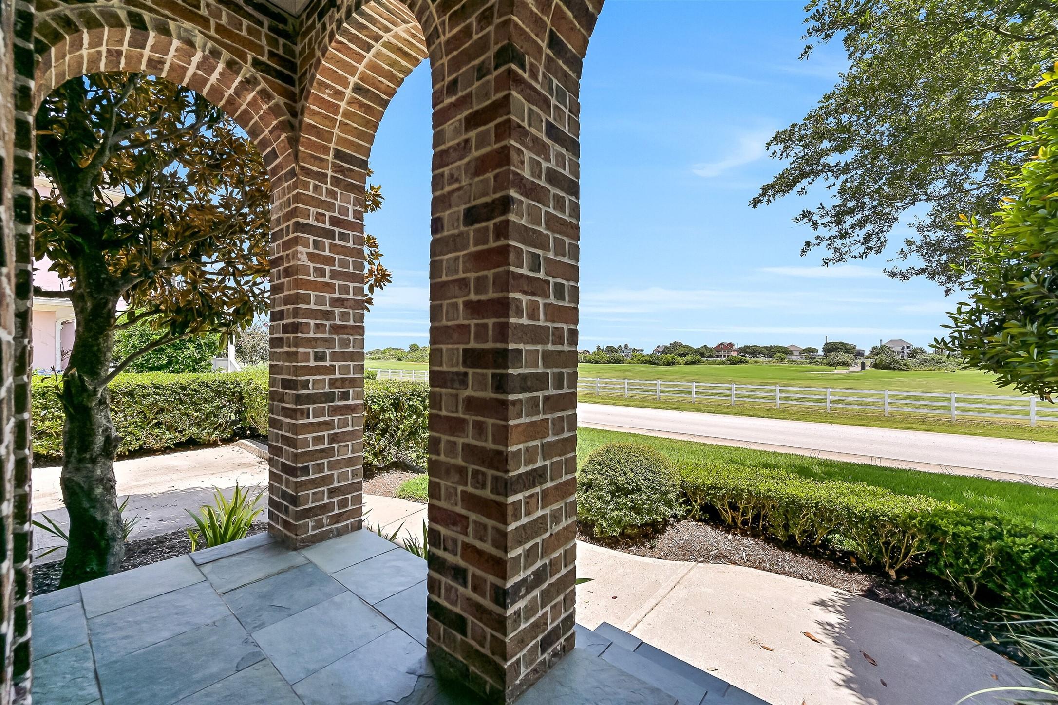 Image 3: This East-facing covered porch enjoys vistas of th