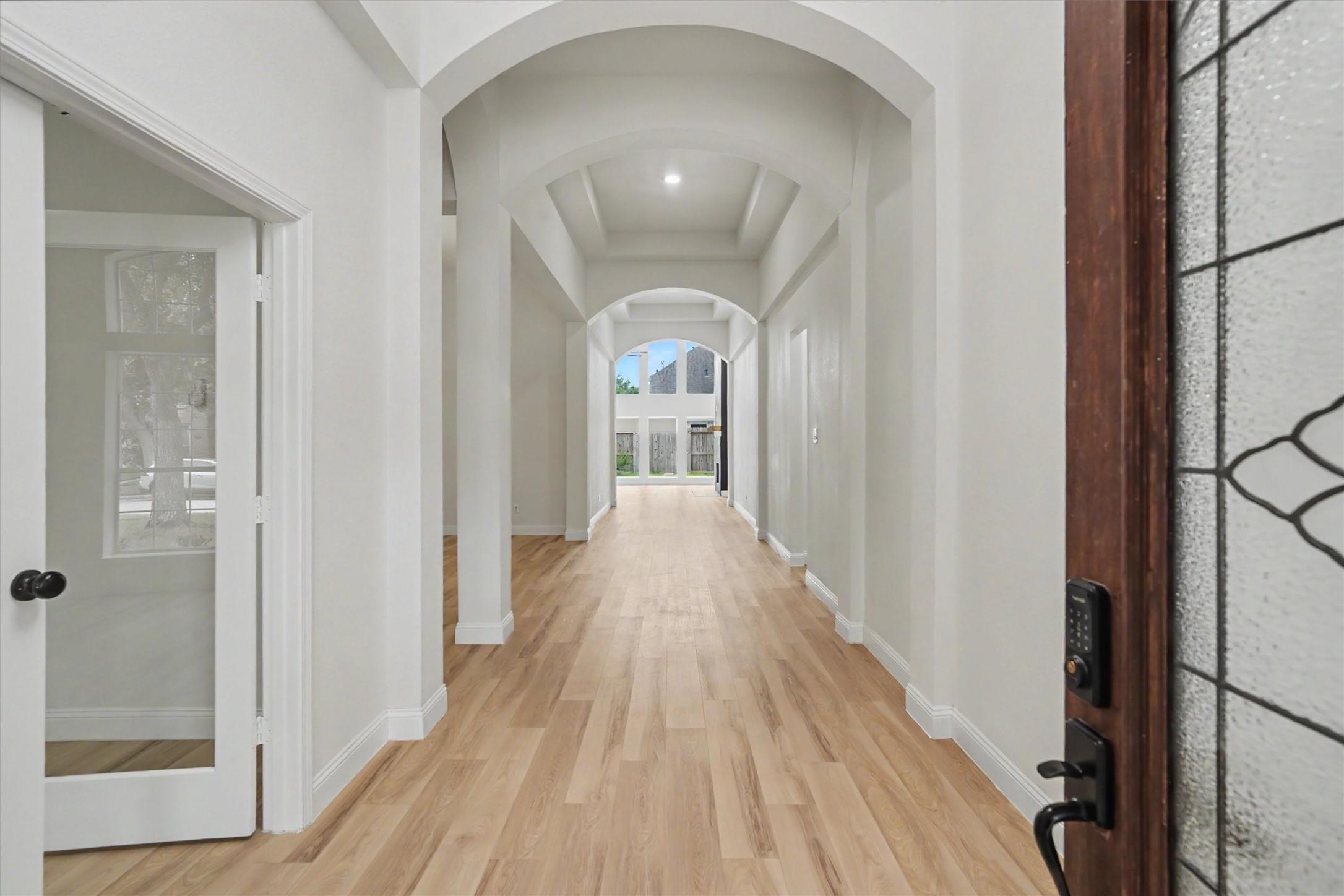 Image 2: Grand entryway with fresh paint, new LVP flooring