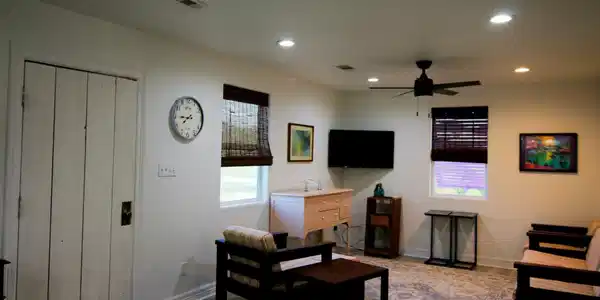 Image 4: Cozy living room with neutral walls and a ceiling