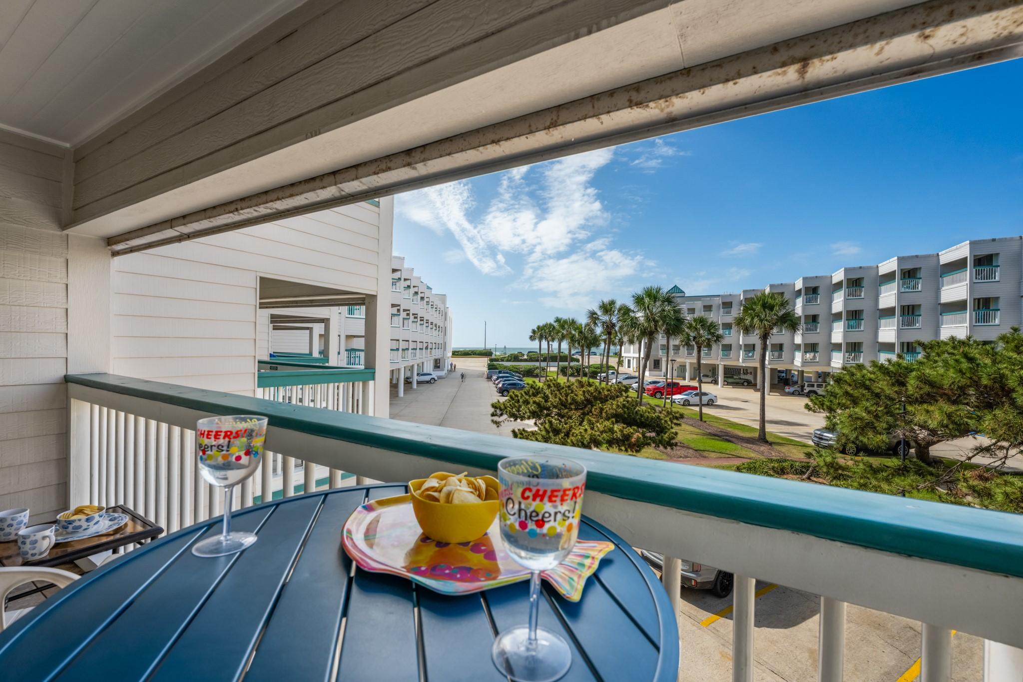 Image 2: Private covered balcony with a coastal-inspired se