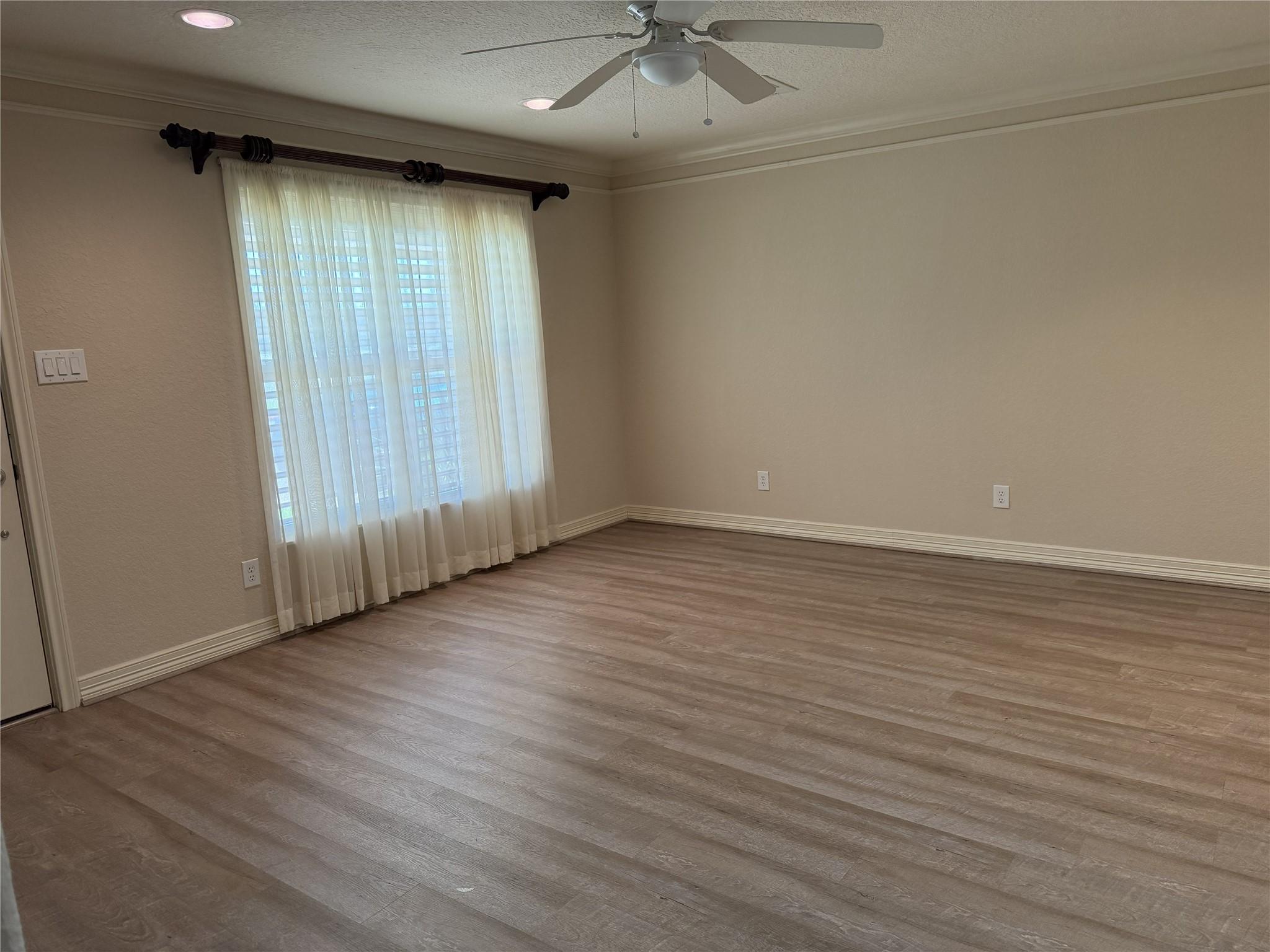 Image 3: The large picture window in the living room provid
