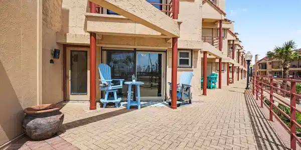 Image 2: Patio area.  Hurricane shutter for security during