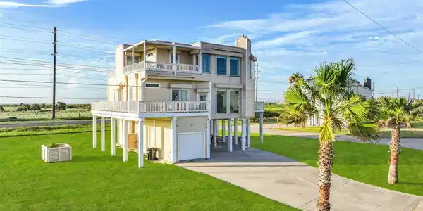 Image 3: Another look at the home highlights its balconies
